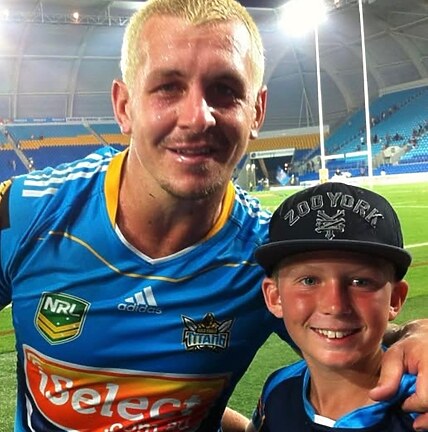 A young Jaylan De Groot with Titans legend Greg Bird in 2013.