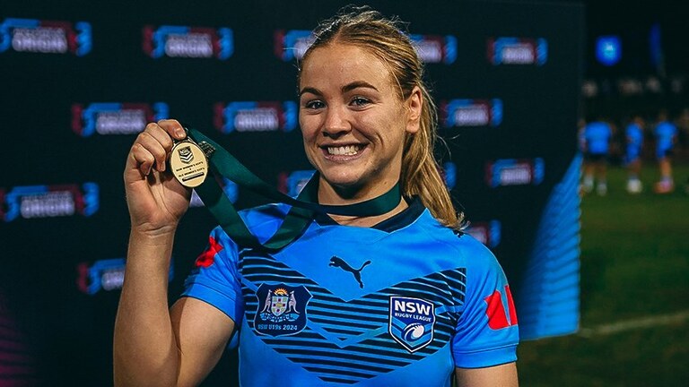 Kasey Reh poses with her Player of the Match Medal after last year's fixture.