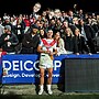 Nathan Lawson celebrates his NRL debut with some of the 85 family and friends he arranged tickets for.
