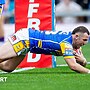 Warrington Wolves player Cameron Smith dives over the line to score a try against Leeds Rhinos.