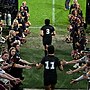 Kotoni Staggs runs out for the Broncos in their black jersey supporting the Black Dog Insitute.