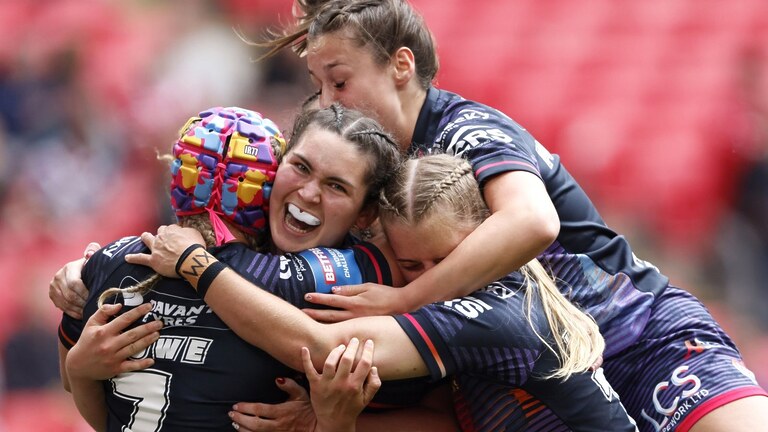 Naomi Williams celebrates scoring a try during the Women's Challenge Cup final