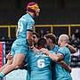 Huddersfield players celebrate Tui Lolohea’s try