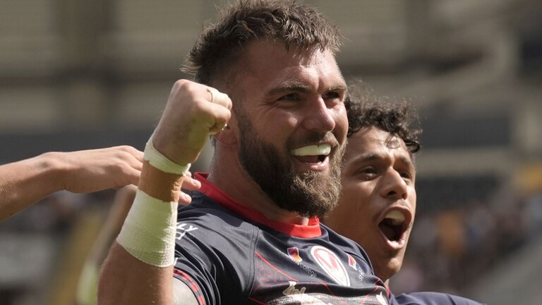 St Helens' Kyle Feldt celebrates scoring a try against Hull FC