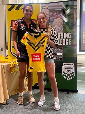 Ana Malupo presents Jakiya Whitfeld with her Jillaroos jersey in Las Vegas.