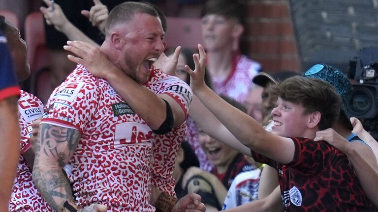 Leigh Leopards' Josh Charnley celebrates scoring his side's sixth try of the game
