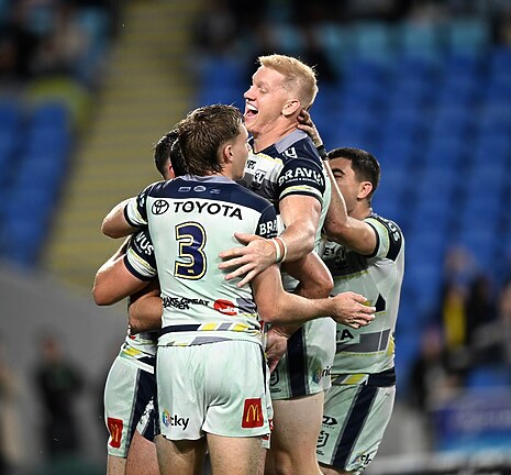 Griffin Neame helps lead the celebrations after a Cowboys try.