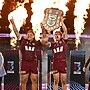 Josh Papalii holds up the State of Origin Shield with Maroons captain Cameron Munster after answering an SOS to play in the series decider