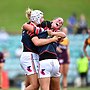 Hannah Southwell, Raecene McGregor and Tayla Predebon  celebrate the Roosters semi-final defeat of Brisbane in 2021.
