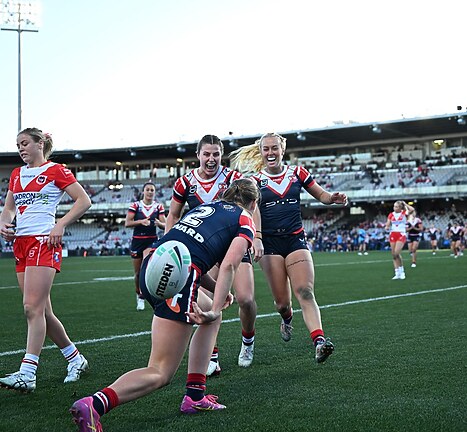 Roosters celebrate a Try in their Round 2 win over the Dragons.