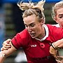 Beth Dainton on Wales is tackled against England