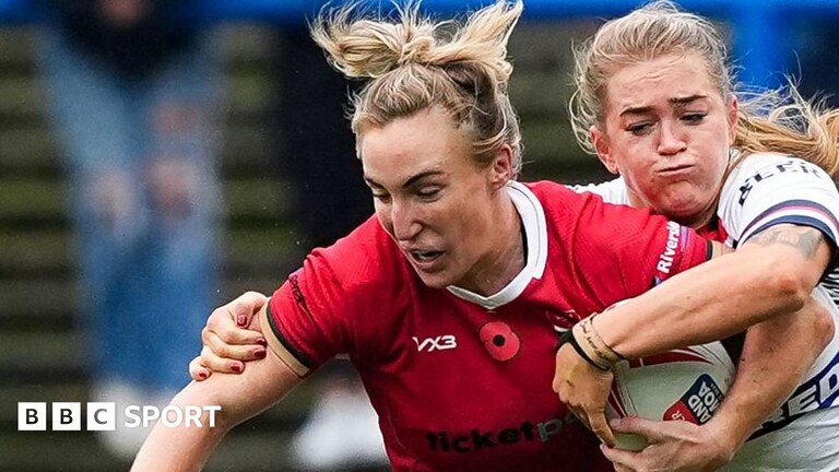 Beth Dainton on Wales is tackled against England
