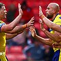 Warrington players celebrate a try by James Harrison (second right)