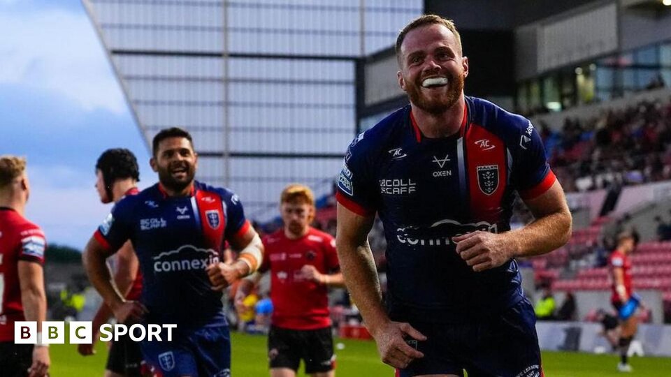 Hull Kingston Rovers winger Joe Burgess celebrates a try against Salford Red Devils with teammate Peta Hiku
