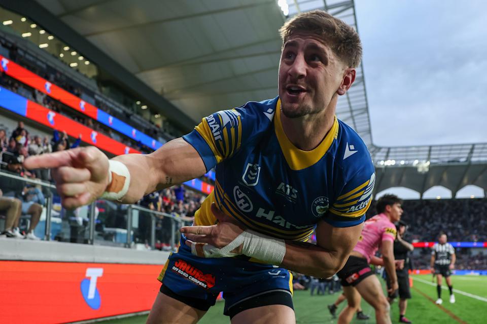 Zac Lomax celebrates scoring a try.