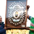 Ricky Stuart and Raiders captain Joseph Tapine, pictured here with the JJ Giltinan Shield.