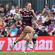 A Brisbane Broncos NRLW player tucks the ball under her arm and sprints away downfield to score.