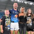 Seen here, retiring Titans veteran Kieran Foran poses for a photo with his family after his final game in the NRL.