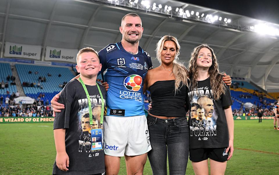 Seen here, retiring Titans veteran Kieran Foran poses for a photo with his family after his final game in the NRL.