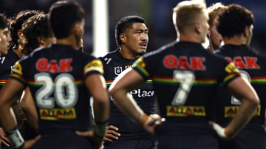 Panthers players in a huddle during NRL loss to Knights.