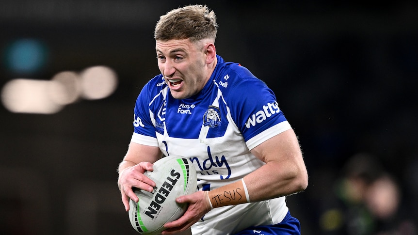 Max King of the Bulldogs running with the NRL ball