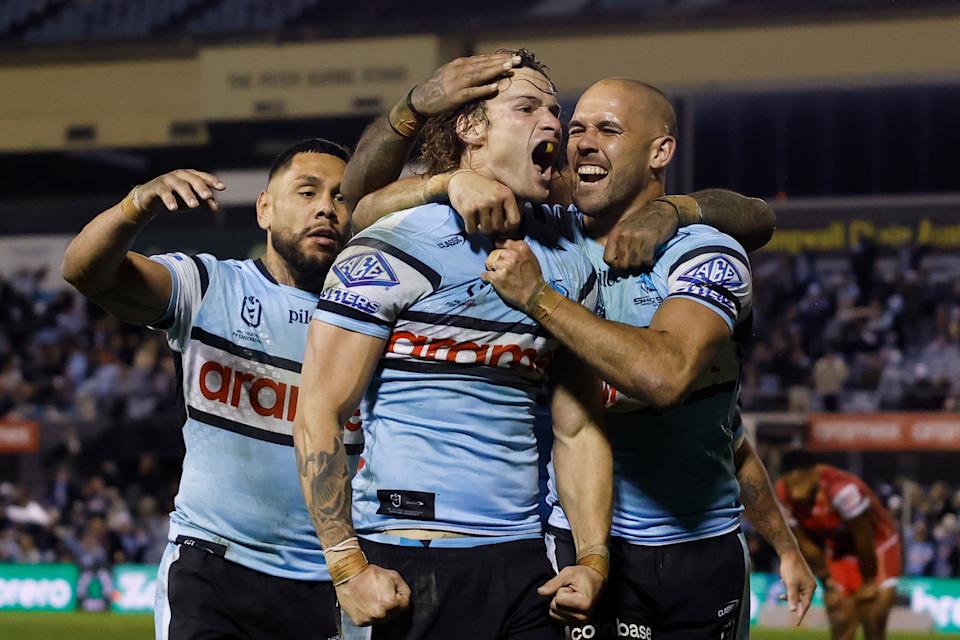 Pictured middle, Cronulla Sharks star Nicho Hynes.