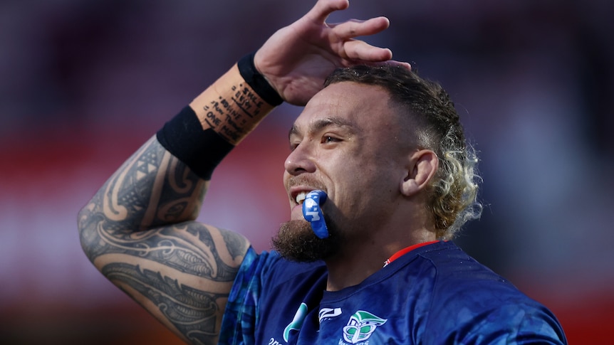 A man warms up for a rugby league match