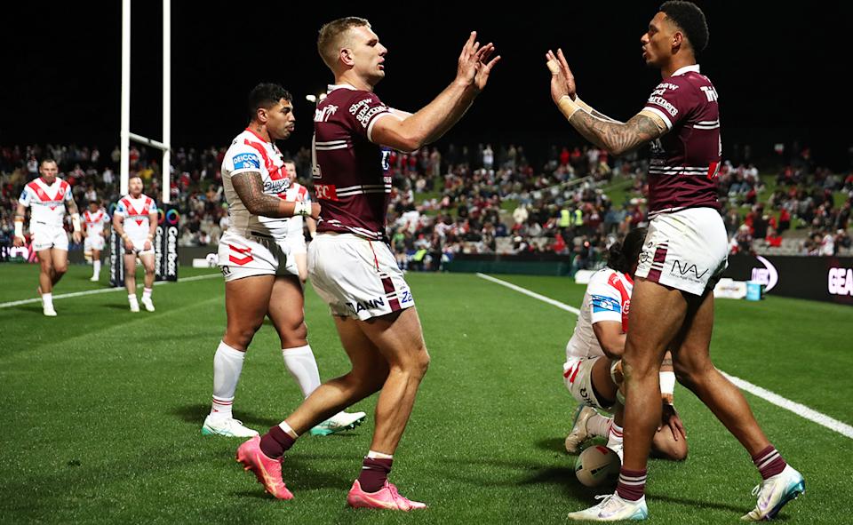 Sea Eagles players in action against the Dragons.