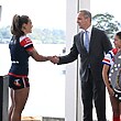 NRL CEO Andrew Abdo congratulates Sydney Roosters captain Isabelle Kelly on the club's minor premiership win.
