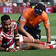 Hamiso Tabuai-Fidow of the Dolphins is seen being treated by a medic in an NRL match