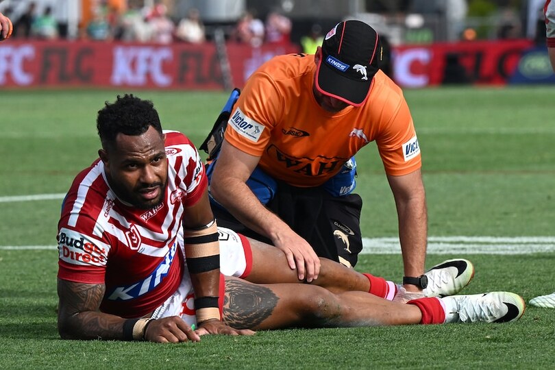 Hamiso Tabuai-Fidow of the Dolphins is seen being treated by a medic in an NRL match