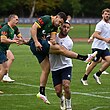 Nathan Cleary gets a kick away under pressure during the Kangaroos' scrimmage session against France in London.