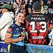 Megan Pakulis with a fan after making her NRLW debut for the Gold Coast Titans.