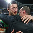 Michael Maguire celebrates South Sydney's 2014 grand final win with Sam Burgess.