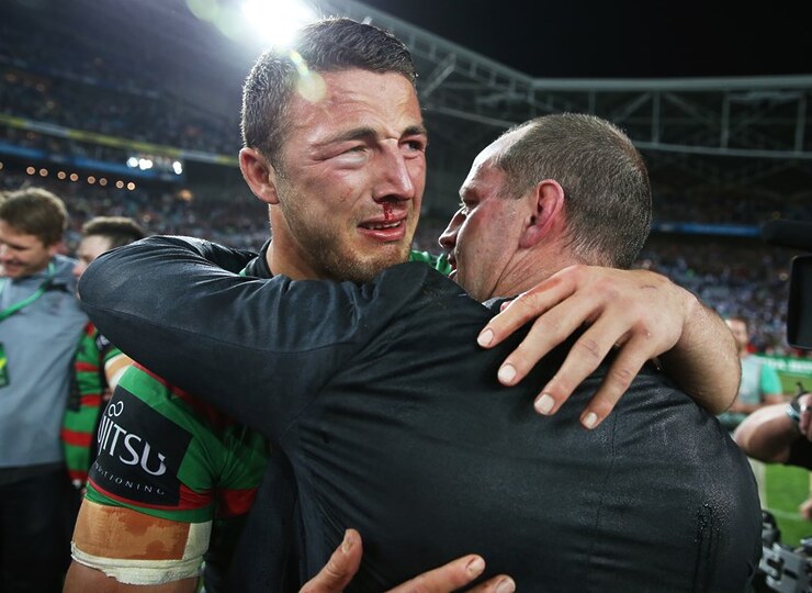 Michael Maguire celebrates South Sydney's 2014 grand final win with Sam Burgess.