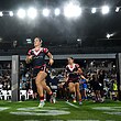 Isabelle Kelly leads out the Roosters.