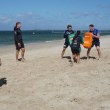 Bulldogs players Matt Burton, Kurt Mann and Harry Hayes (L to R)  help members of the Milperra Colts train at Brighton Beach.
