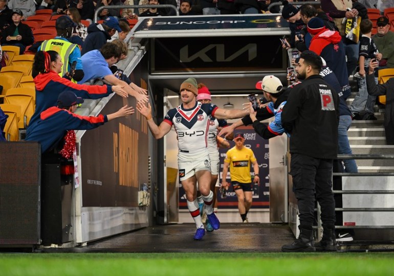 Connor Watson runs out with the Roosters during the Beanies for Brain Cancer round against the Broncos.