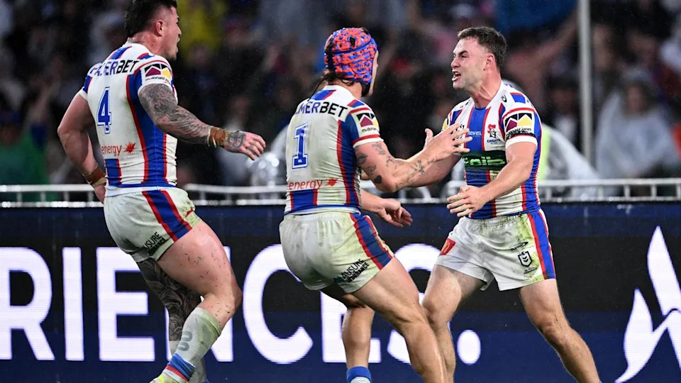 Kalyn Ponga (centre) rushes to Sandon Smith
