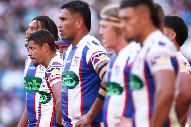 Jacob Saifiti looks on with his teammates.